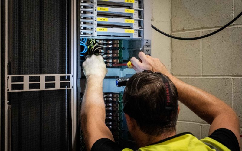 Man fixing lighting cables